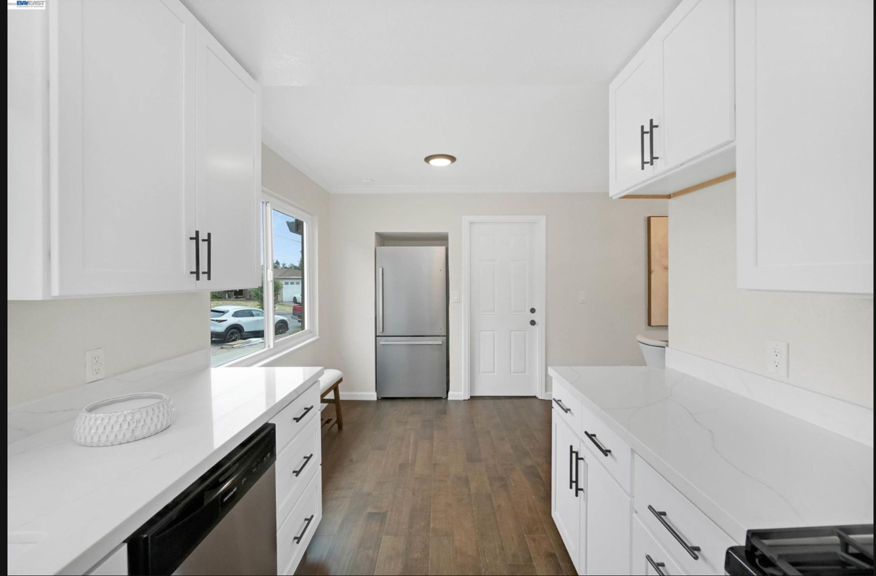 Kitchen with stainless refrigerator